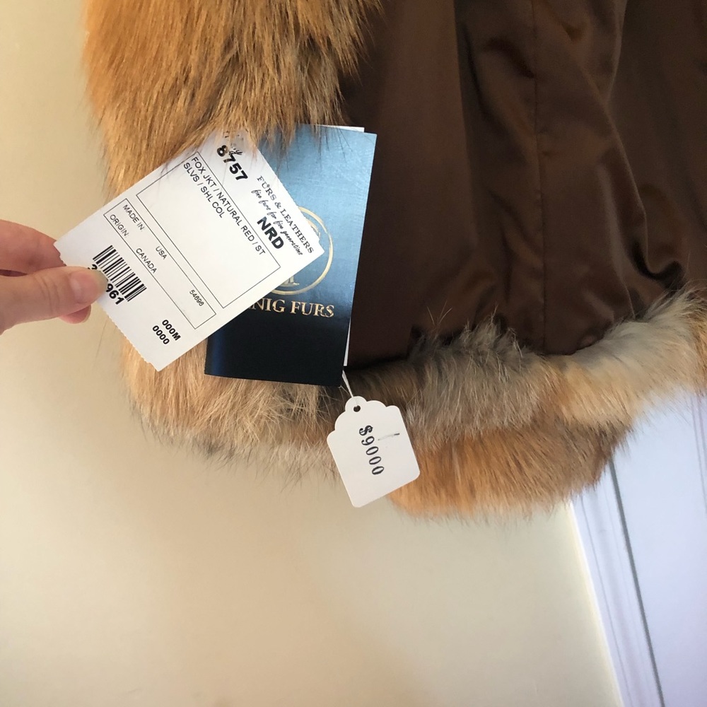 Genuine Fox fur, medium size, colors are orange, brown.